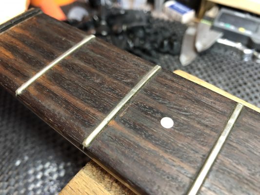 Pitted frets